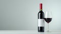 Elegant red wine bottle and glass isolated on white background for sophisticated display Royalty Free Stock Photo