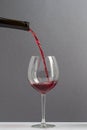 elegant red wine bottle pour glass Royalty Free Stock Photo