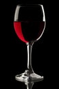 Elegant red wine glass in black background Royalty Free Stock Photo