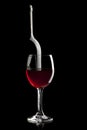 Elegant red wine glass and a wine bottle Royalty Free Stock Photo