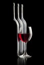 Elegant red wine glass and a wine bottles Royalty Free Stock Photo