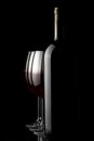 Elegant red wine glass and a wine bottles Royalty Free Stock Photo