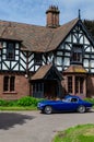 Elegant retro Car in front of old tudor house. Classic cars festival `Brums and Buns` at Chester, UK Royalty Free Stock Photo