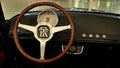 Elegant retro driving wheel and round analogue speedometer in cockpit of Patak Rodster