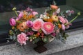 Elegant rich red pink orange designer bouquet of florist with different flowers, peony and roses
