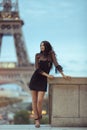 Parisian woman near the Eiffel tower in Paris, France. Royalty Free Stock Photo