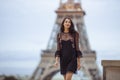 Parisian woman near the Eiffel tower in Paris, France. Royalty Free Stock Photo