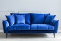 Elegant Royal Blue Velvet Sofa in a Modern Minimalist Living Room Setting Royalty Free Stock Photo