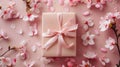 Elegant Sakura Gift Box with Pale Pink Satin Ribbon and Blooming Flowers on Soft Pink Background