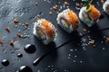 Elegant salmon sushi rolls on black backdrop Royalty Free Stock Photo