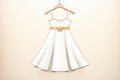 elegant satin fabric white girls dress on a hanger