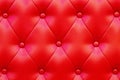 Elegant saturated glossy red leather texture of sofa chair Royalty Free Stock Photo