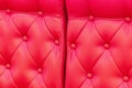 Elegant saturated glossy red leather texture of sofa chair Royalty Free Stock Photo