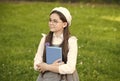 Elegant schoolgirl child girl study with book in park, school pupil concept Royalty Free Stock Photo