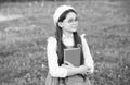 Elegant schoolgirl child girl study with book in park, school pupil concept Royalty Free Stock Photo