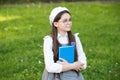 Elegant schoolgirl child girl study with book in park, school pupil concept Royalty Free Stock Photo