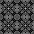 Elegant seamless pattern. fancy white lace with flowers and leaves on black background. symmetrical textile design