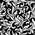 Elegant seamless pattern. Tracery of swirls and decorative leaves on a black background. Vintage style.