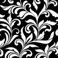 Elegant seamless pattern. Tracery of swirls and decorative leaves on a black background. Vintage style. Royalty Free Stock Photo
