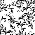 Elegant seamless pattern. Tracery of swirls and leaves on a whi Royalty Free Stock Photo