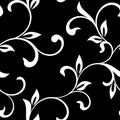 Elegant seamless pattern. Tracery of twisted stalks with decorative leaves on a black background. Vintage style. The pattern can