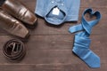 Elegant set: brown men`s shoes, brown leather belt, blue shirt, Royalty Free Stock Photo