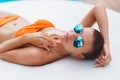 Beautiful young woman laying in bikini during sunbath next to swimming pool Royalty Free Stock Photo