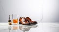 Elegant Shoes And Whiskey Glass On Marble Countertop