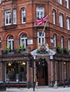 Elegant shop with Union Jack and coat of arms, London