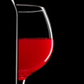 Elegant silhouette bottle of red wine and glass on black background Royalty Free Stock Photo