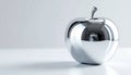 Elegant Silver Apple Sculpture on a White Surface Royalty Free Stock Photo