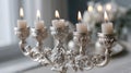 Elegant silver candelabrum with lit candles in soft ambient lighting Royalty Free Stock Photo
