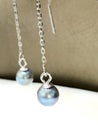 Elegant Silver Chain Drop Earrings with Light Black Tahitian Pearls Royalty Free Stock Photo