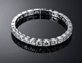 Elegant Silver Diamond Bracelet on Glossy Black Reflective Surface Close Up Royalty Free Stock Photo