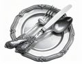 Elegant Silver Dinner Setting with Decorative Plate and Cutlery Isolated on White Royalty Free Stock Photo