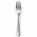 Elegant silver fork with intricate handle design on white background Royalty Free Stock Photo