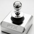 Elegant silver joystick controller labeled ptx on a sleek metallic base Royalty Free Stock Photo