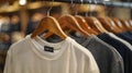 Elegant Simplicity: Chic Shirts on Wooden Hangers. Concept Minimalist Fashion, Wooden Hangers, Royalty Free Stock Photo