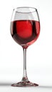 Elegant Single Stemmed Glass of Red Wine Isolated on a Solid White Studio Background Royalty Free Stock Photo