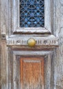 An elegant sixties apartment building`s main entrance, with marble stairs and a framed glass door Royalty Free Stock Photo