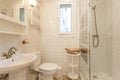 Elegant small bathroom interior with shower and toilet. Royalty Free Stock Photo