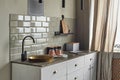Elegant small kitchen with sink and counter at country house. Royalty Free Stock Photo