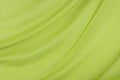 Elegant soft silky flowing light green drapery background