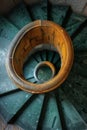 Elegant spiral staircase with intricate ironwork, creating a mesmerizing pattern as it descends. Royalty Free Stock Photo