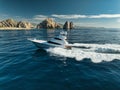 Elegant sportfishing yacht in the ocean in Cabo, Mexico sailing leisurely through a tranquil bay