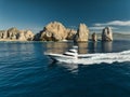 Elegant sportfishing yacht in the ocean in Cabo, Mexico sailing leisurely through a tranquil bay