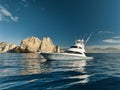 Elegant sportfishing yacht in the ocean in Cabo, Mexico sailing leisurely through a tranquil bay