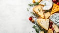 An elegant spread features various cheese types along with fresh herbs and cherry tomatoes, perfect for entertaining Royalty Free Stock Photo