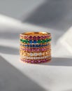 Elegant stack of colorful rings with intricate designs and gems Royalty Free Stock Photo