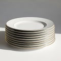 Elegant stack of gold-edged dinner plates isolated on white background Royalty Free Stock Photo